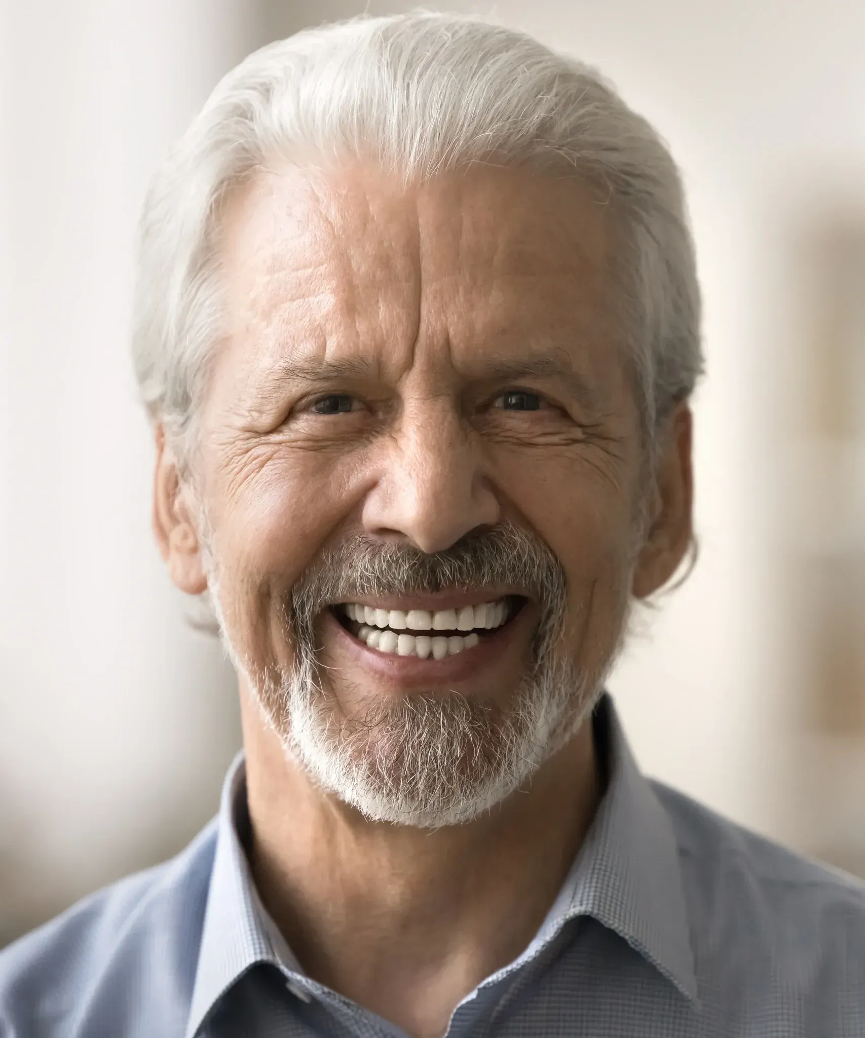 Dentist assessing tooth mobility during a periodontal examination at Smile Brookline MA